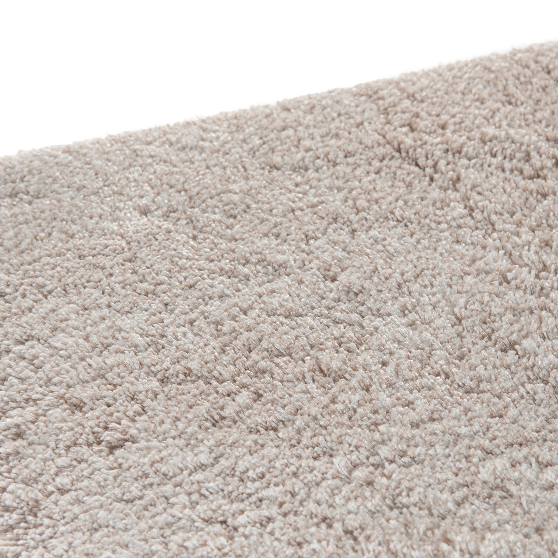 Cozy area rug made from 100% Tencel with velvety soft surface, anti-slip backing, and available in beige