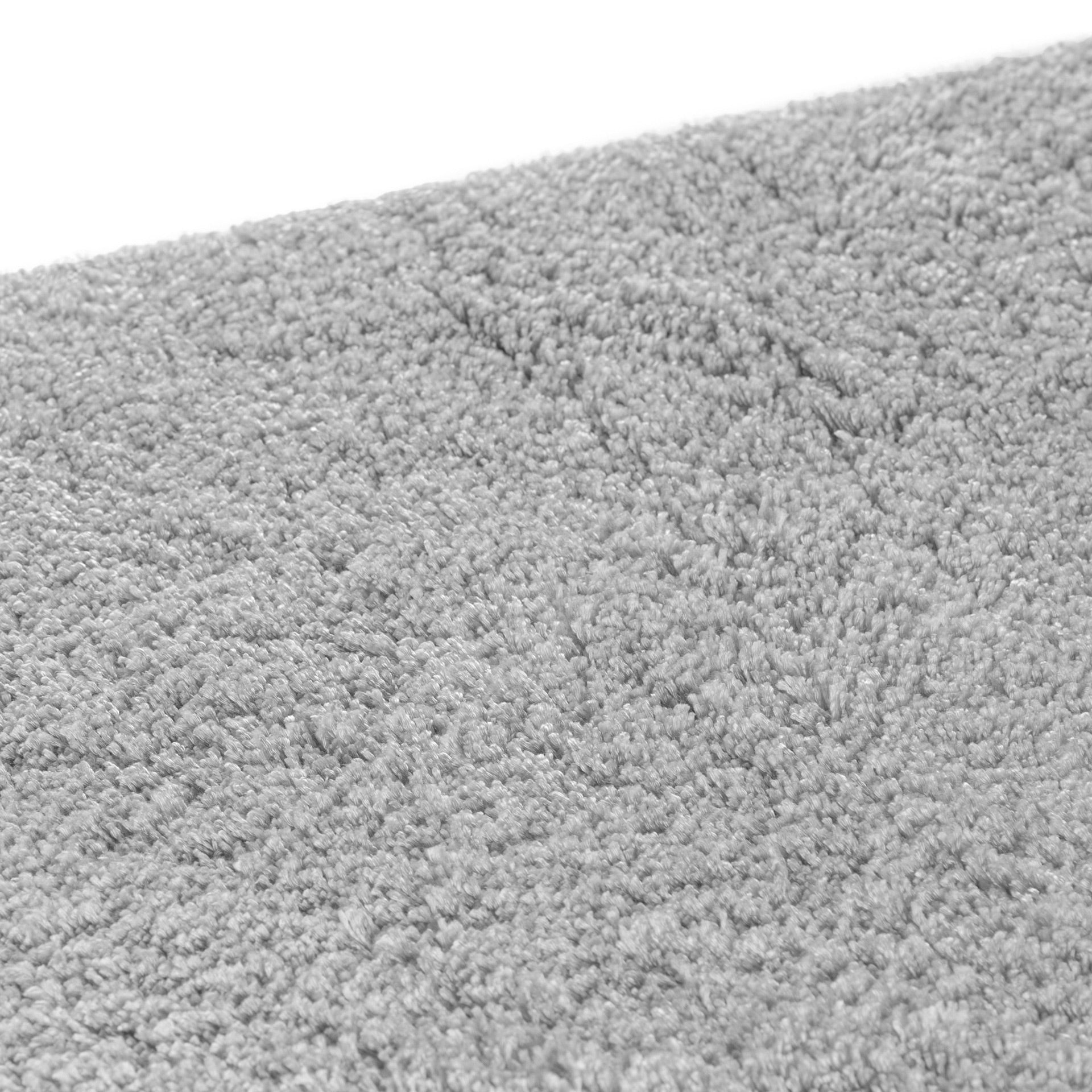 Cozy area rug made from 100% Tencel with velvety soft surface, anti-slip backing, and available in silver