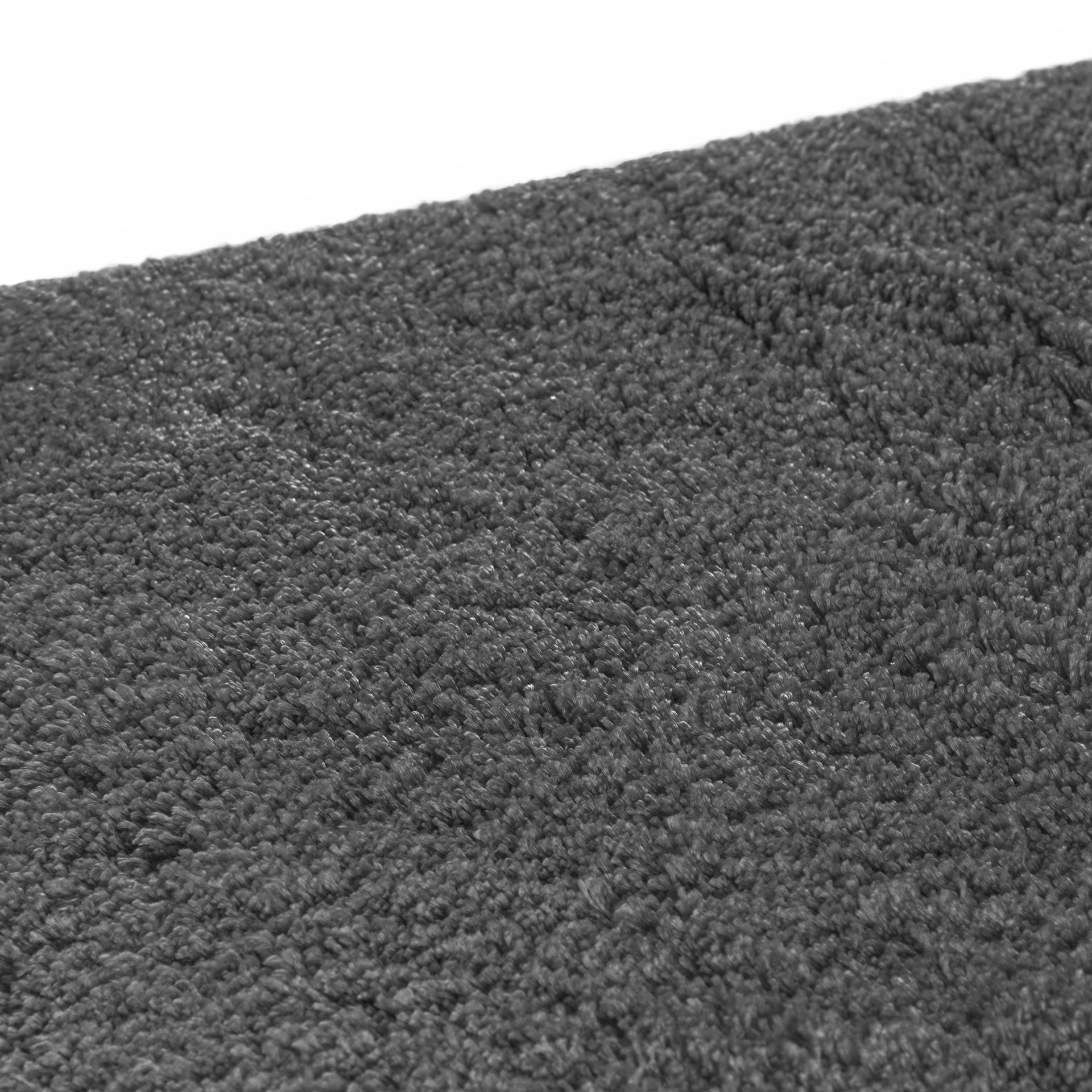 Cozy area rug made from 100% Tencel with velvety soft surface, anti-slip backing, and available in dark grey