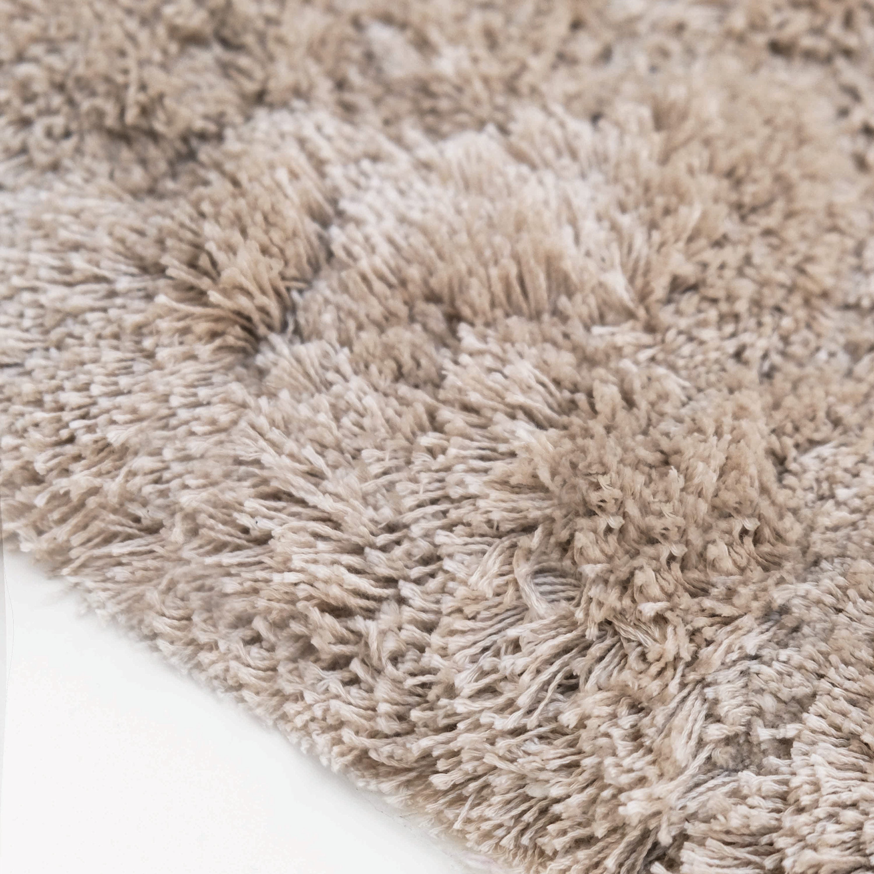 Barnet long-pile area rug in beige Tencel, with soft high-density texture, anti-slip backing, and elegant, refined presence for luxury interiors