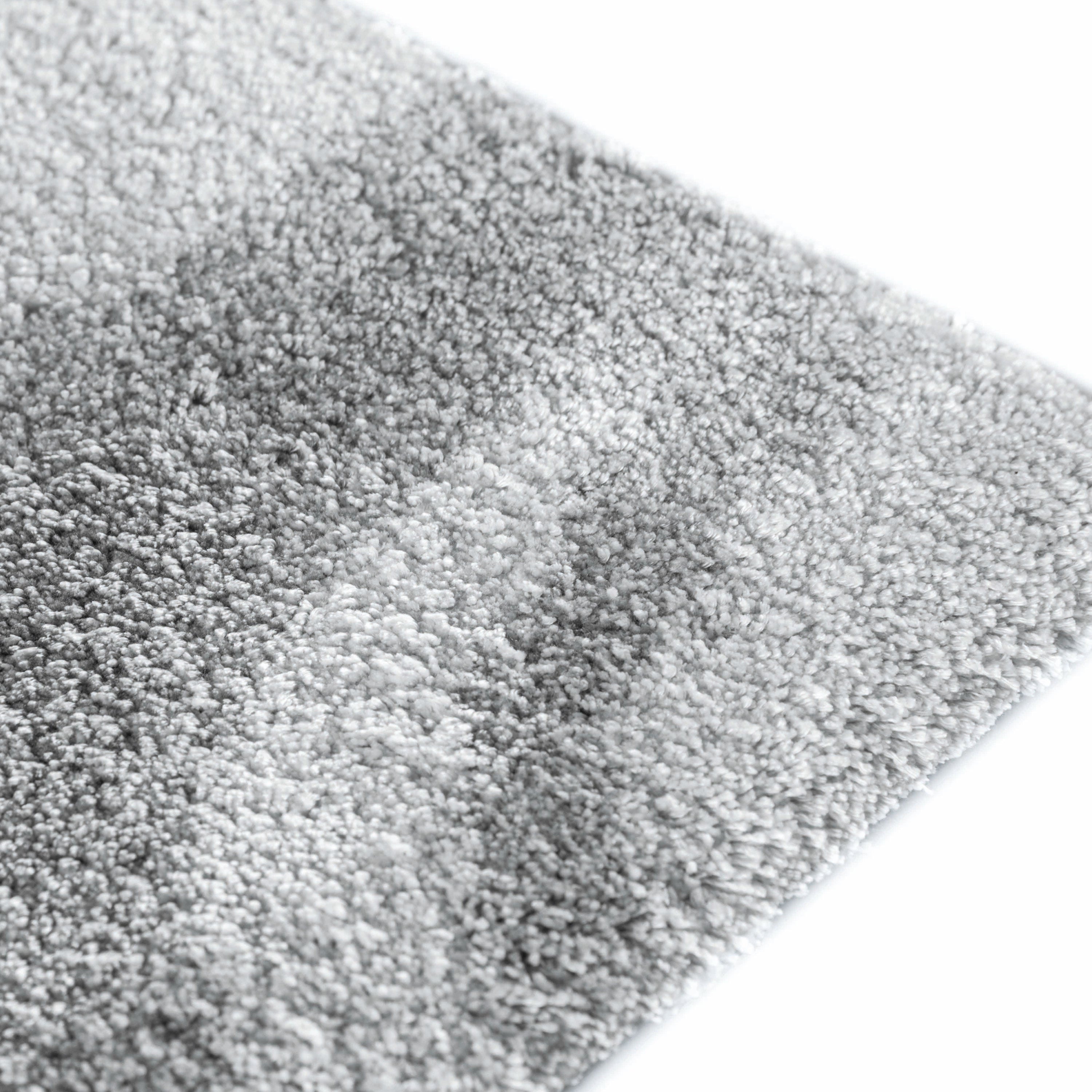 Mist area rug made from 100% Tencel with soft grey and white marble-like design, high-definition texture, and anti-slip backing