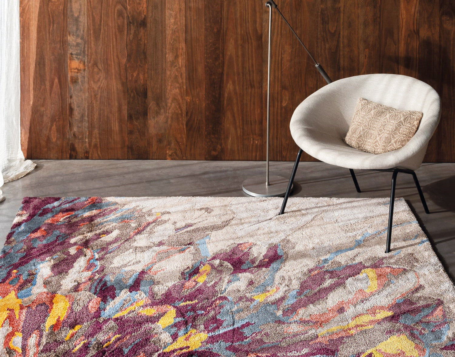 Plume area rug with feathered design in maroon, amber, and blue on a beige Tencel base, high-definition texture and anti-slip backing