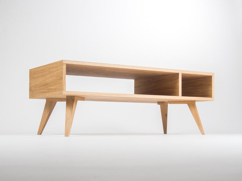 KUUB 3/4 coffee table with rectangular top and open storage compartment in oak or walnut, finished with hardwax oil