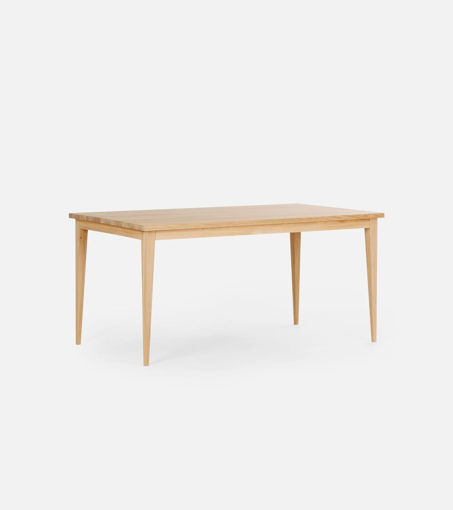 Minimalist solid oak dining table with white-wax finish and natural texture