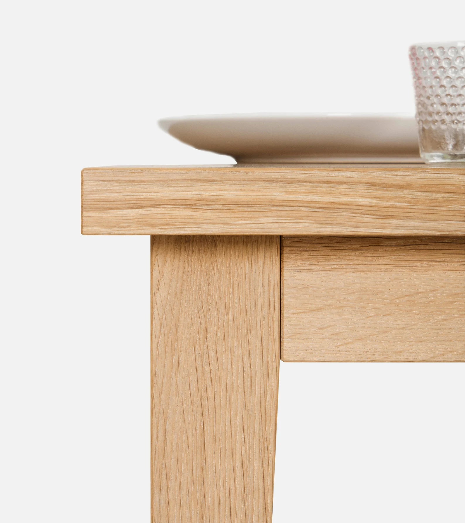 Minimalist solid oak dining table with white-wax finish and natural texture