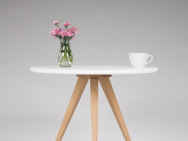 Round coffee table with 3-leg solid oak wood base and matte white scratch-resistant top