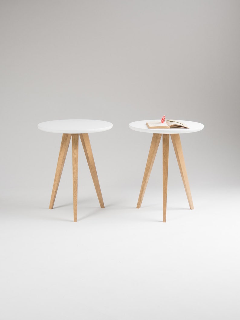 Set of two FINN 3 nightstands with matte white top, three oak legs, milled edge detail and scratch-resistant finish