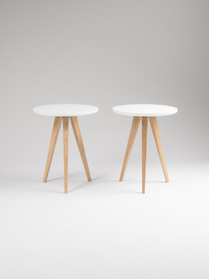 Set of two FINN 3 nightstands with matte white top, three oak legs, milled edge detail and scratch-resistant finish