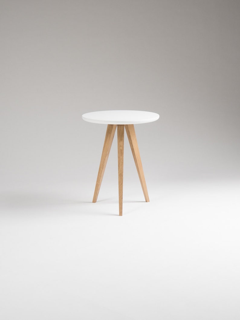 Set of two FINN 3 nightstands with matte white top, three oak legs, milled edge detail and scratch-resistant finish