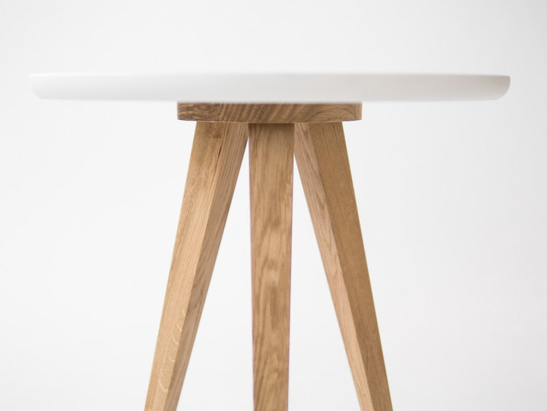 Set of two FINN 3 nightstands with matte white top, three oak legs, milled edge detail and scratch-resistant finish