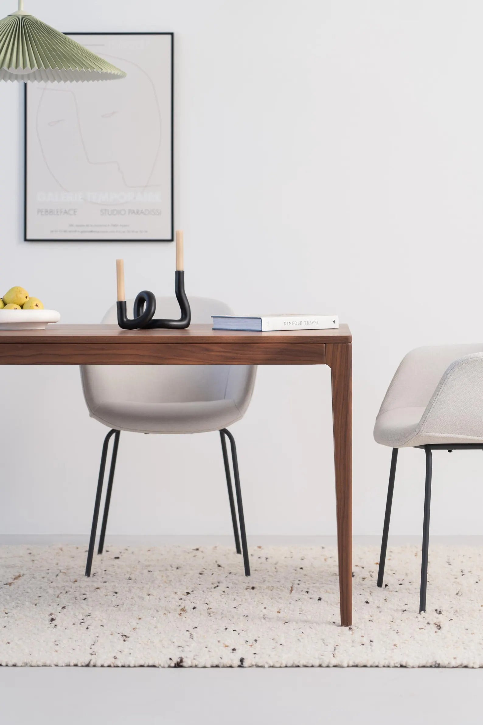 Solid walnut dining table with natural finish and minimalist lines, ideal for gatherings, seats 6 to 8 people