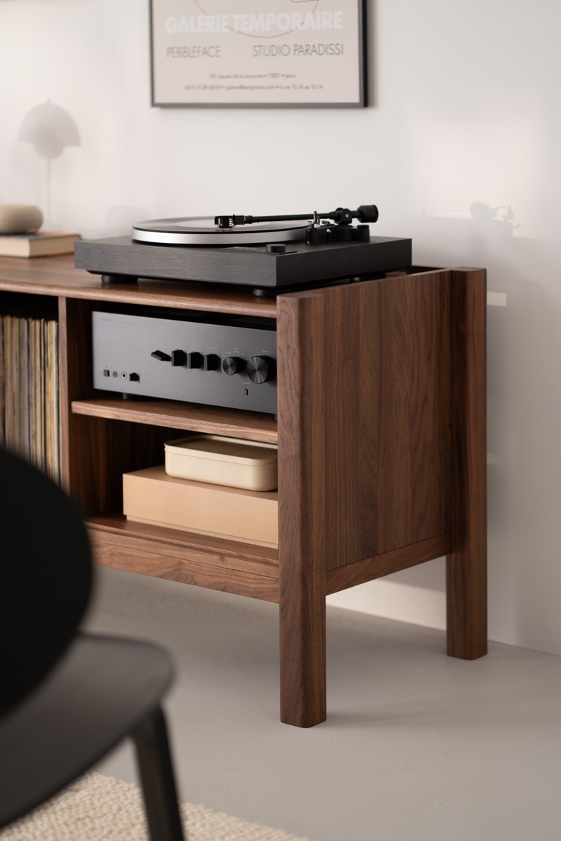 Wide walnut TV console with slatted doors, drawers, and cable management