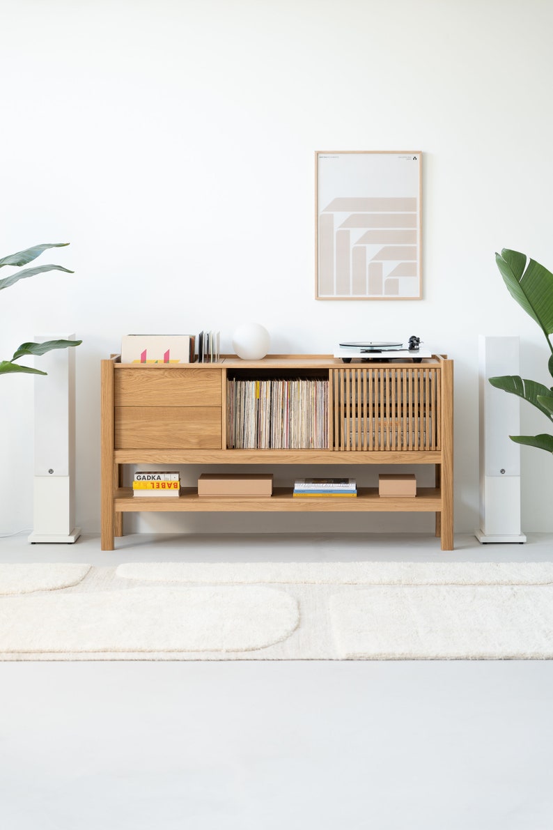 Low-profile media console in oak with sliding front panel