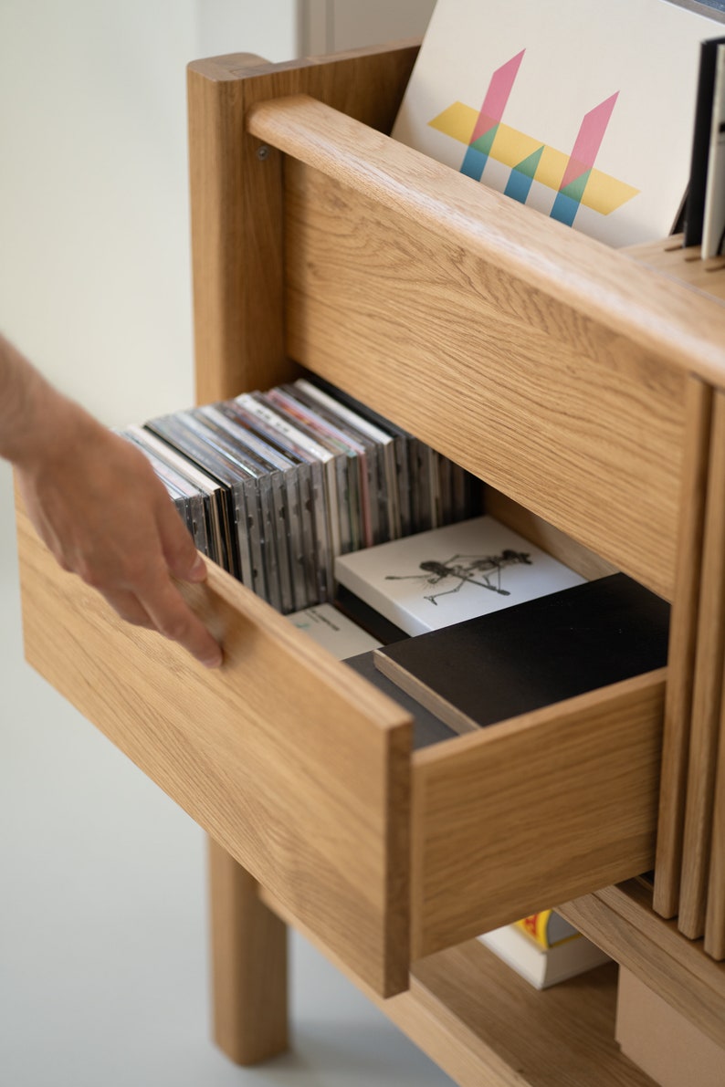 Low-profile media console in oak with sliding front panel