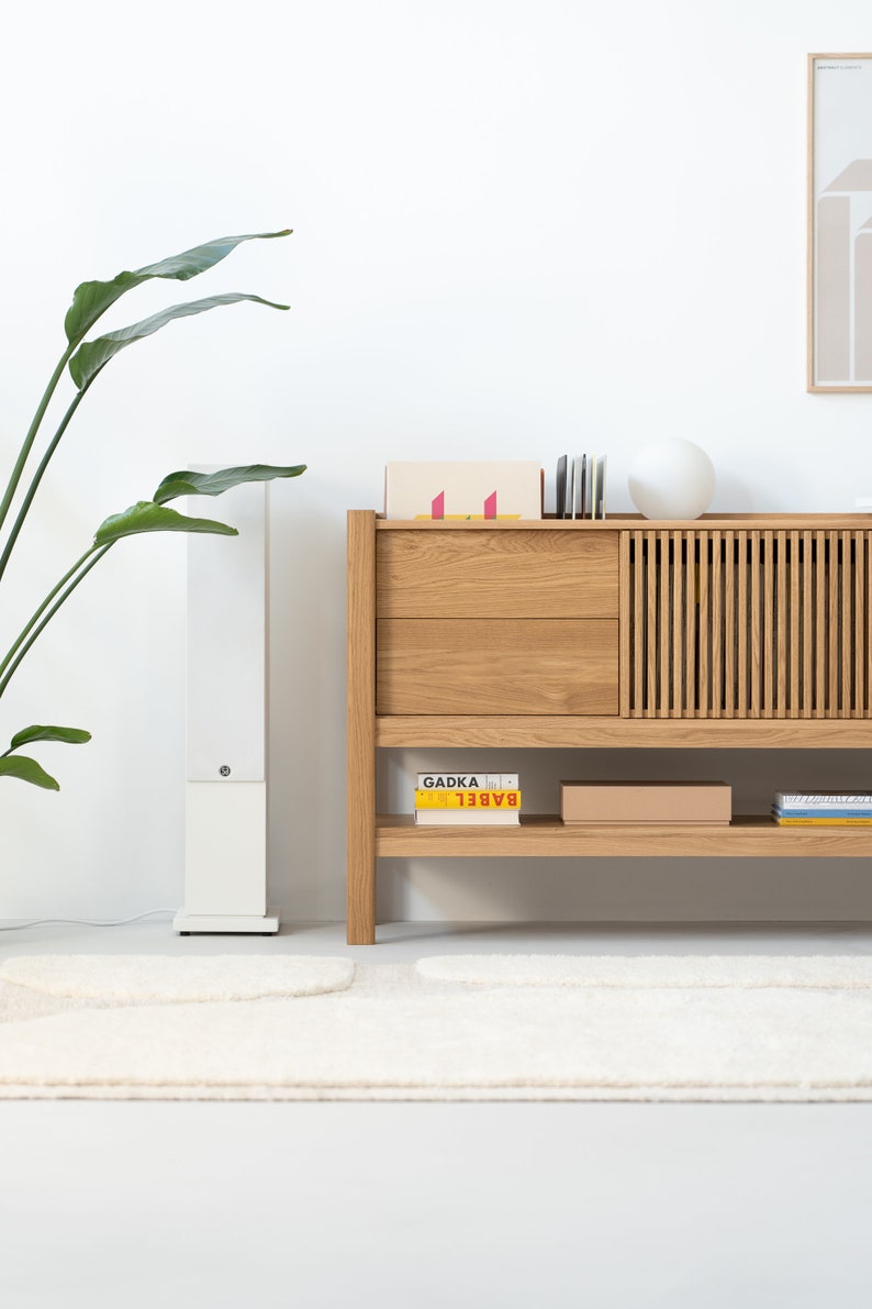 Low-profile media console in oak with sliding front panel
