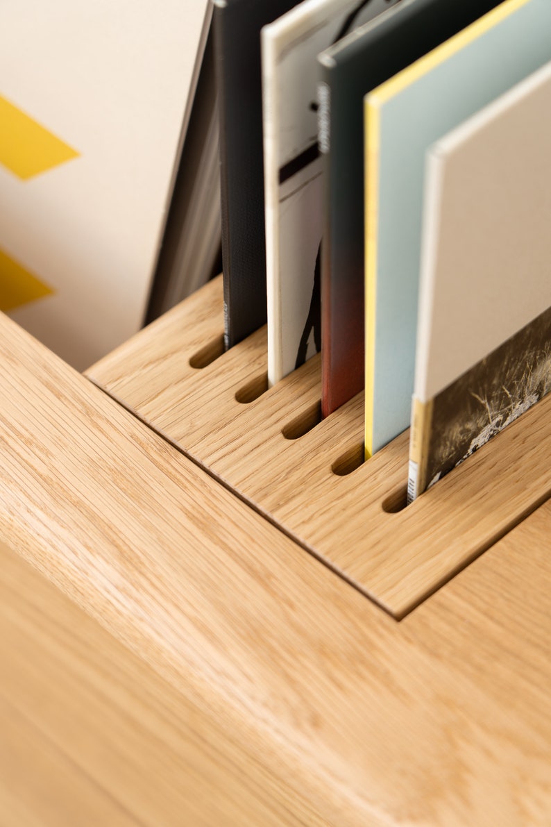 Low-profile media console in oak with sliding front panel