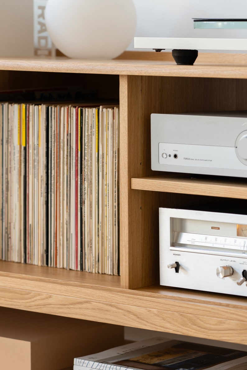 Low-profile media console in oak with sliding front panel