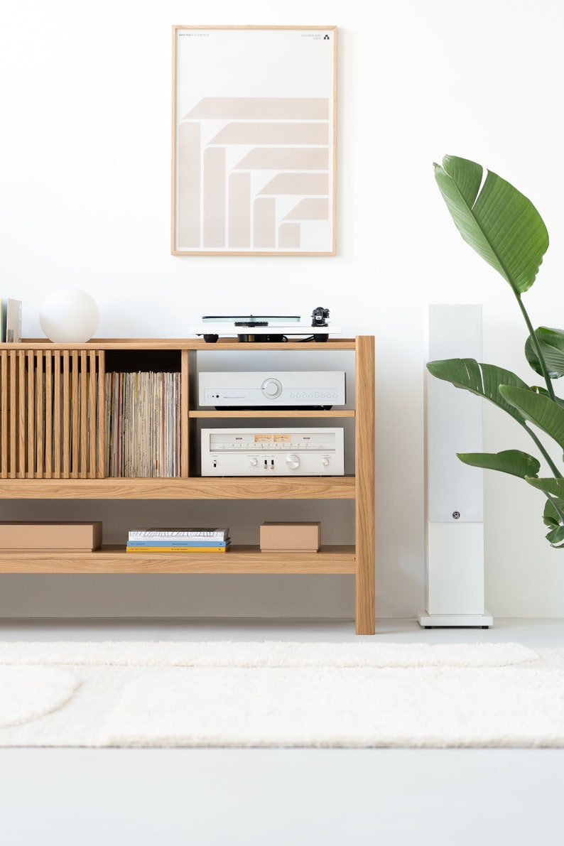 Low-profile media console in oak with sliding front panel