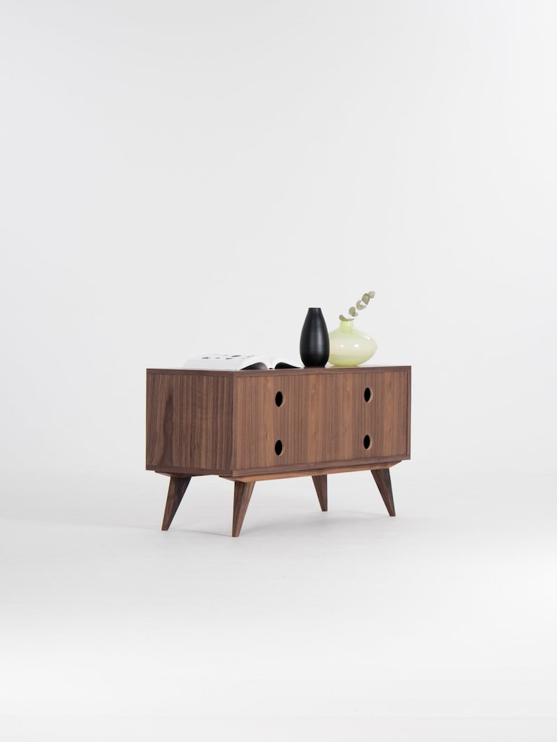 KUUB TV console with two side-sliding doors, walnut veneer, customizable wood fronts, cable holes, and hardwax oil finish