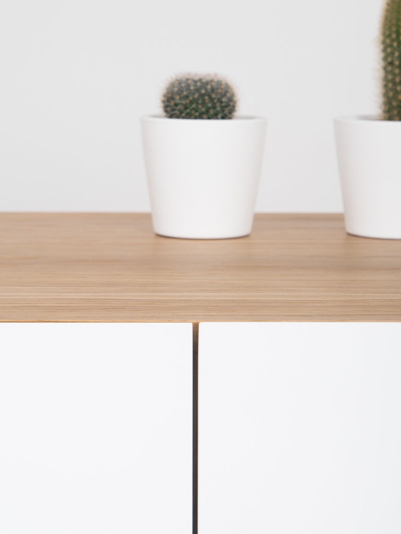 VELO TV console with three equal front-opening doors, oak veneer, low-profile design, customizable white fronts, hardwax oil finish