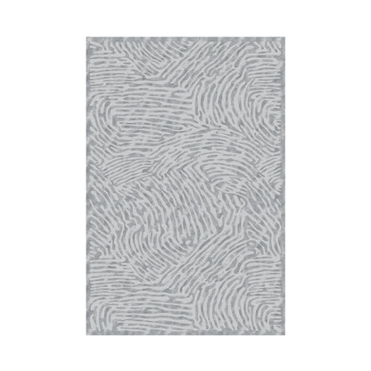 Creta area rug made from 100% Tencel, with soft, plush striated texture in a neutral tone and anti-slip backing for refined comfort