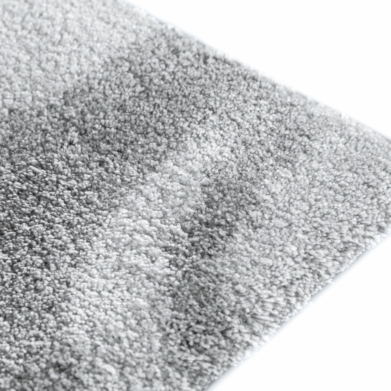 Mist area rug made from 100% Tencel with soft grey and white marble-like design, high-definition texture, and anti-slip backing