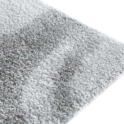 Mist area rug made from 100% Tencel with soft grey and white marble-like design, high-definition texture, and anti-slip backing
