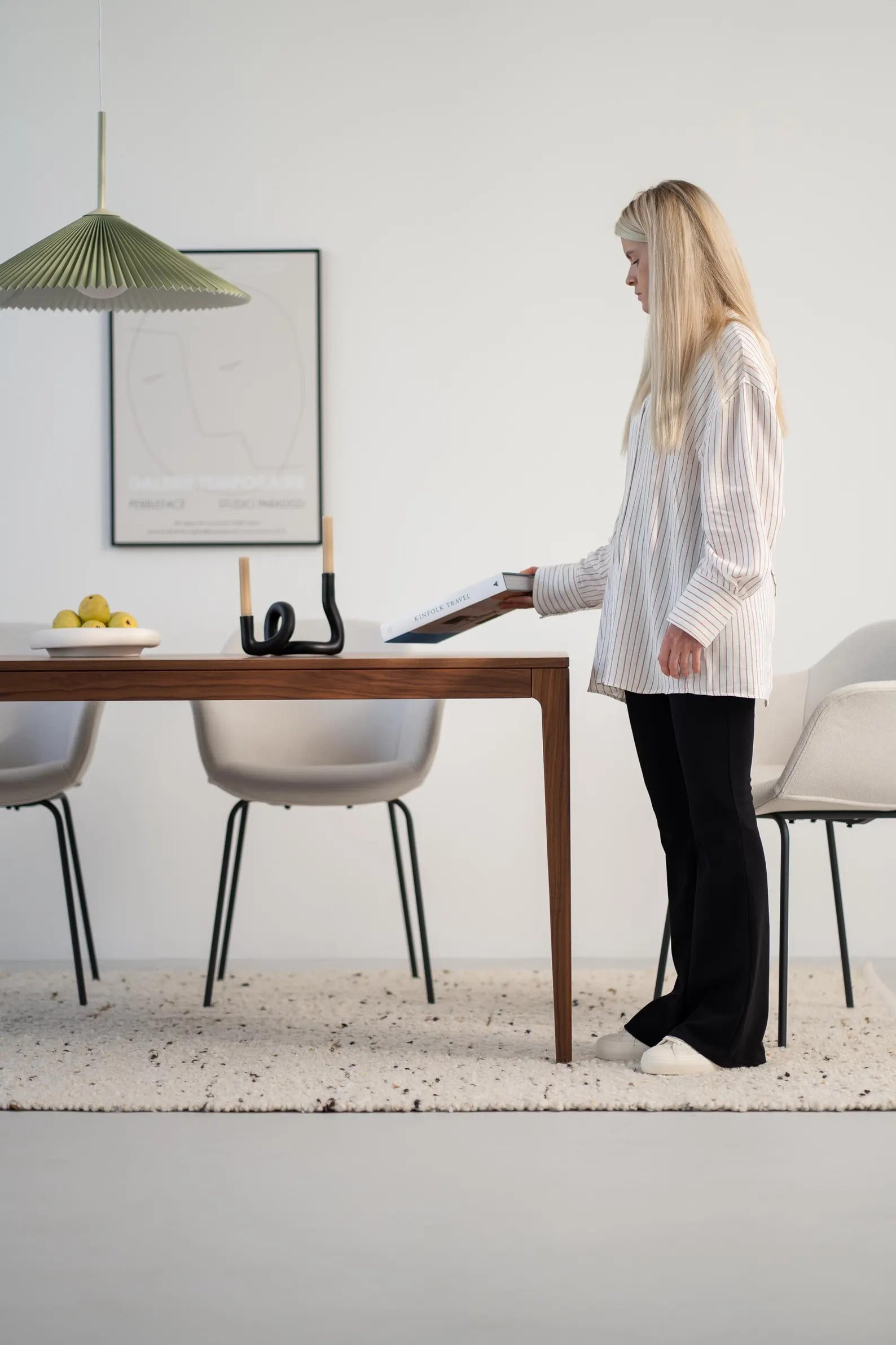 Solid walnut dining table with natural finish and minimalist lines, ideal for gatherings, seats 6 to 8 people 
