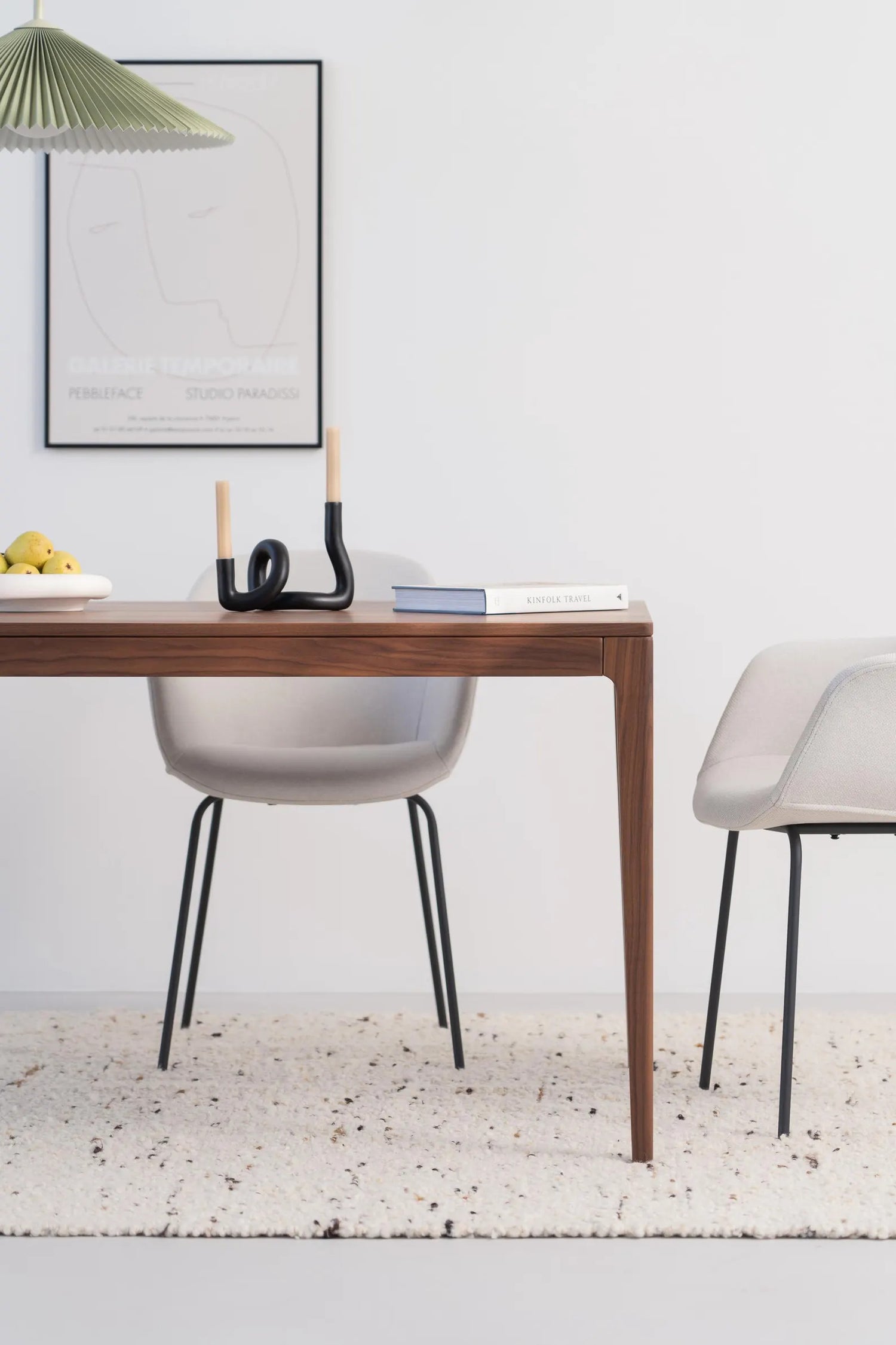 Solid walnut dining table with natural finish and minimalist lines, ideal for gatherings, seats 6 to 8 people 