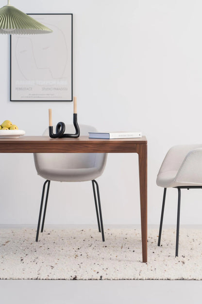 Solid walnut dining table with natural finish and minimalist lines, ideal for gatherings, seats 6 to 8 people 