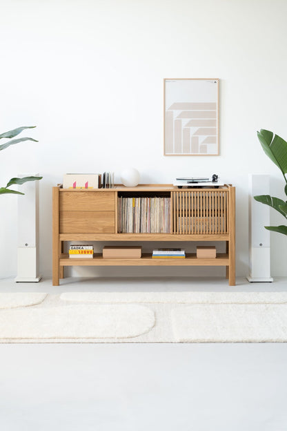 Low-profile media console in oak with sliding front panel 