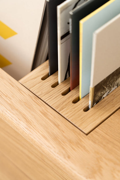 Low-profile media console in oak with sliding front panel 