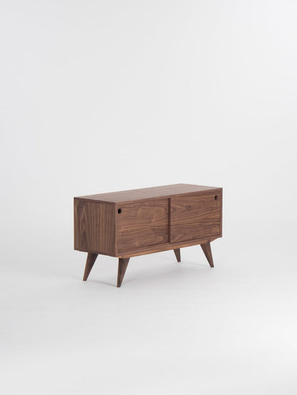 KUUB TV console with two side-sliding doors, walnut veneer, customizable wood fronts, cable holes, and hardwax oil finish