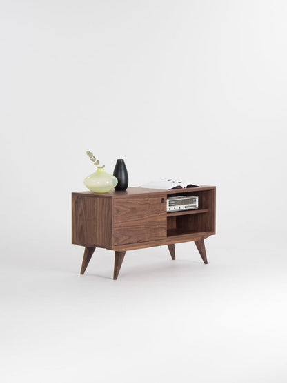 KUUB TV console with two side-sliding doors, walnut veneer, customizable wood fronts, cable holes, and hardwax oil finish