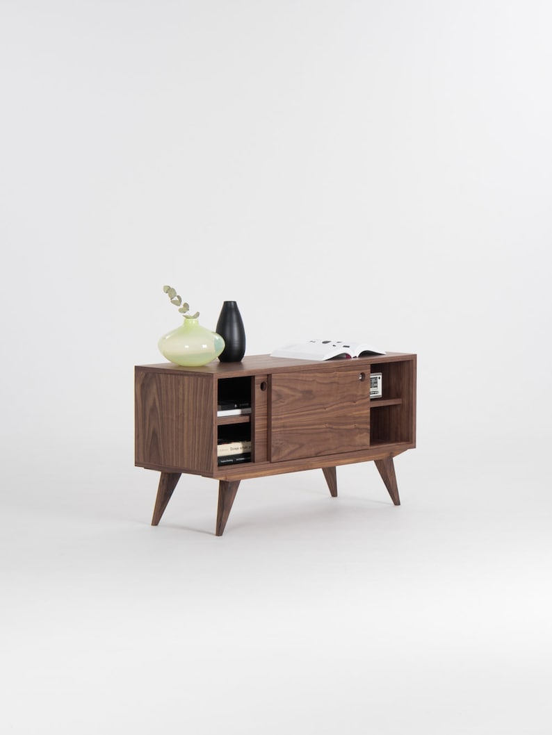 KUUB TV console with two side-sliding doors, walnut veneer, customizable wood fronts, cable holes, and hardwax oil finish
