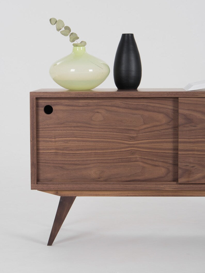KUUB TV console with two side-sliding doors, walnut veneer, customizable wood fronts, cable holes, and hardwax oil finish
