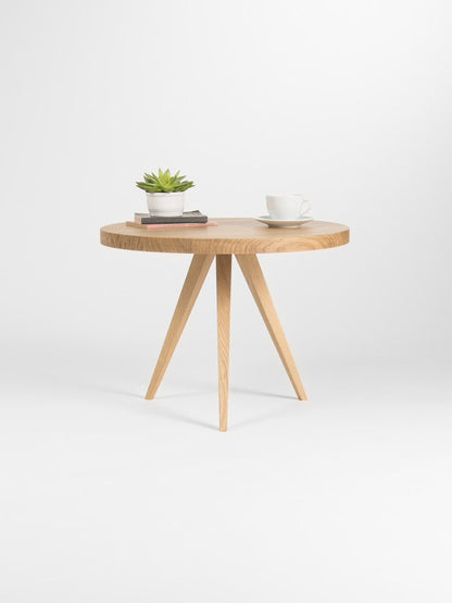 OKKO 60 compact round coffee table in solid oak with hardwax oil finish and natural wood grain