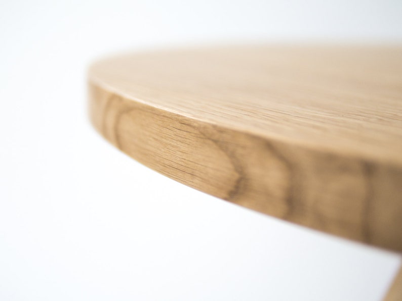 Round solid wood dining table with 3-leg base in oak or walnut and natural hardwax oil finish