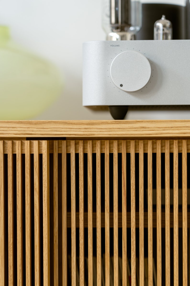 Wide oak media console with openwork front and customizable compartments 