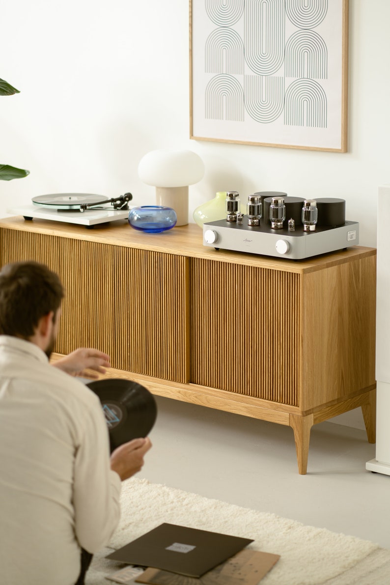 Wide oak media console with openwork front and customizable compartments 