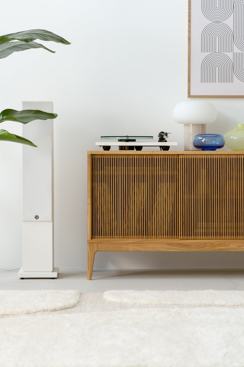 Wide oak media console with openwork front and customizable compartments 