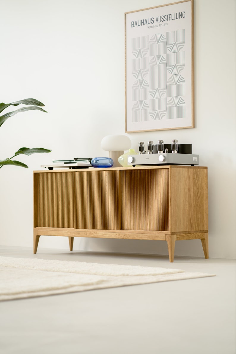 Wide oak media console with openwork front and customizable compartments 