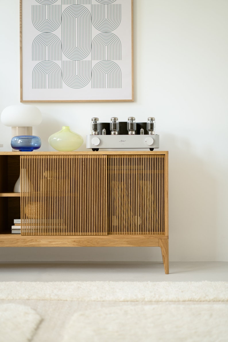 Wide oak media console with openwork front and customizable compartments 
