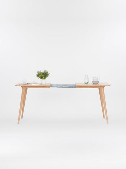 Extendable solid oak dining table with hard oil wax finish, 135 to 185 cm, seats 6 to 8 people 